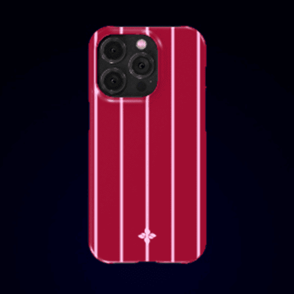 Stylish red iPhone 13 Pro with a pink vertical-striped protective case against a dark background.