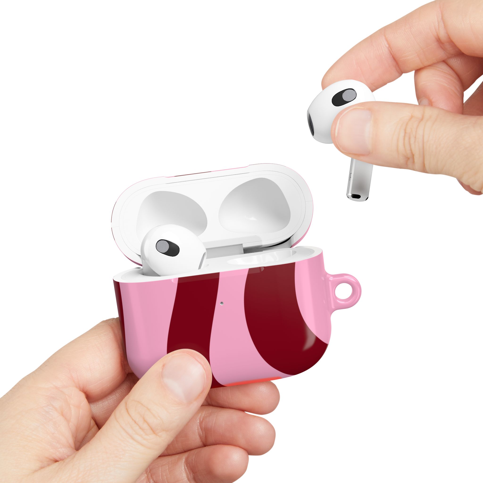Wireless earbuds in a pink floral case, showcasing modern audio technology.