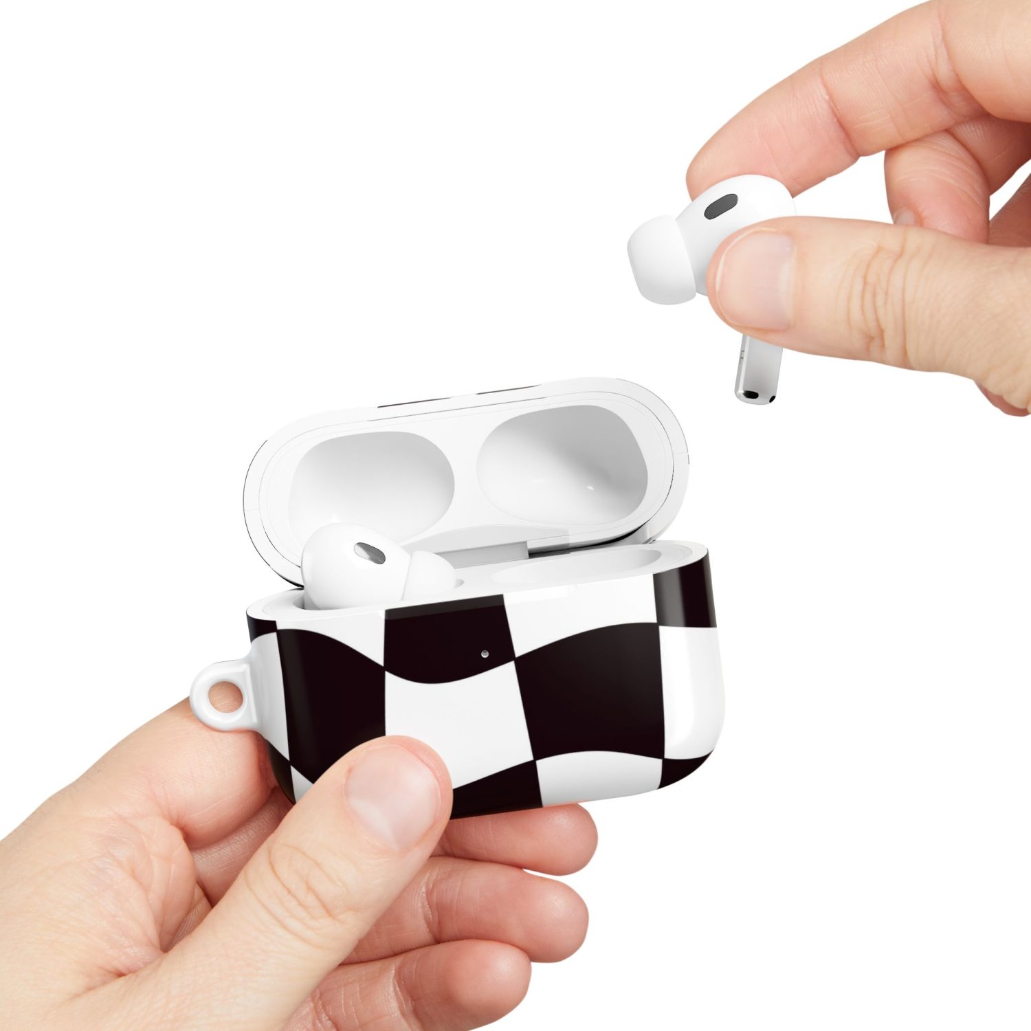 Wireless earbuds in a stylish black and white checkered charging case, focusing on portable audio technology.