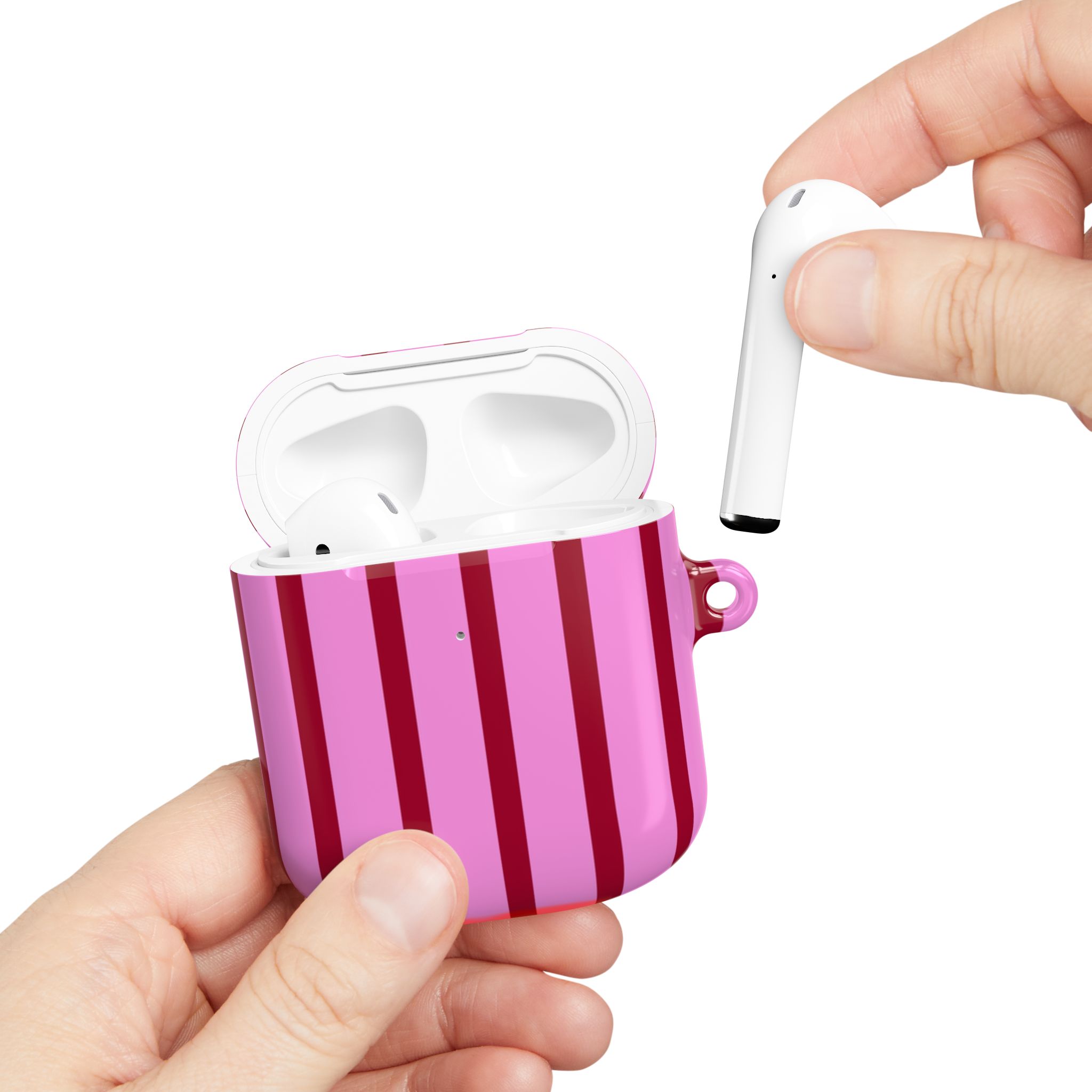 Wireless earbuds in a pink striped charging case with a hand removing one earbud, emphasizing stylish and portable audio accessories from Florayn.