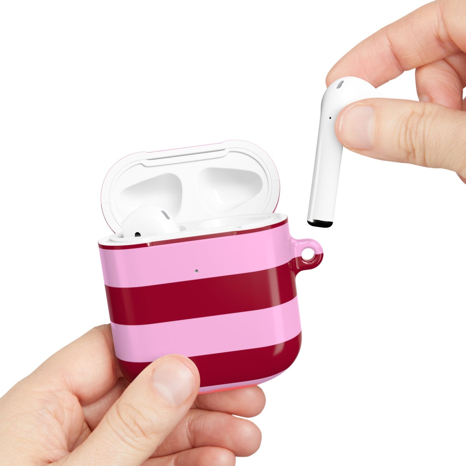 Wireless earbuds in a custom pink and red striped charging case, showcasing trendy and portable audio accessories.