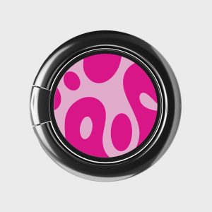 Bright pink and purple laundry detergent pod with abstract design in a sleek black washing machine door, emphasizing colorful, high-quality laundry products from Florayn.